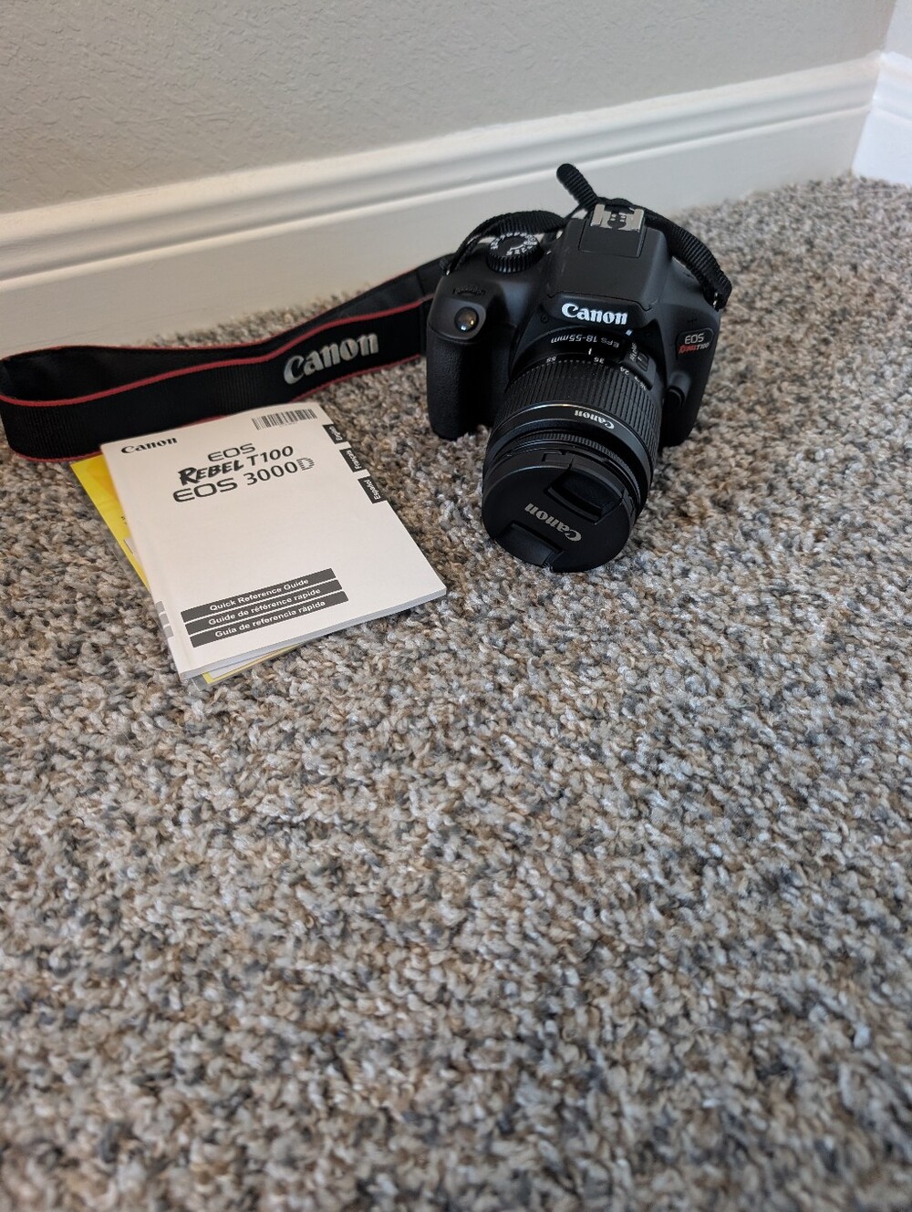 Canon Black DSLR Camera with Lens and Strap